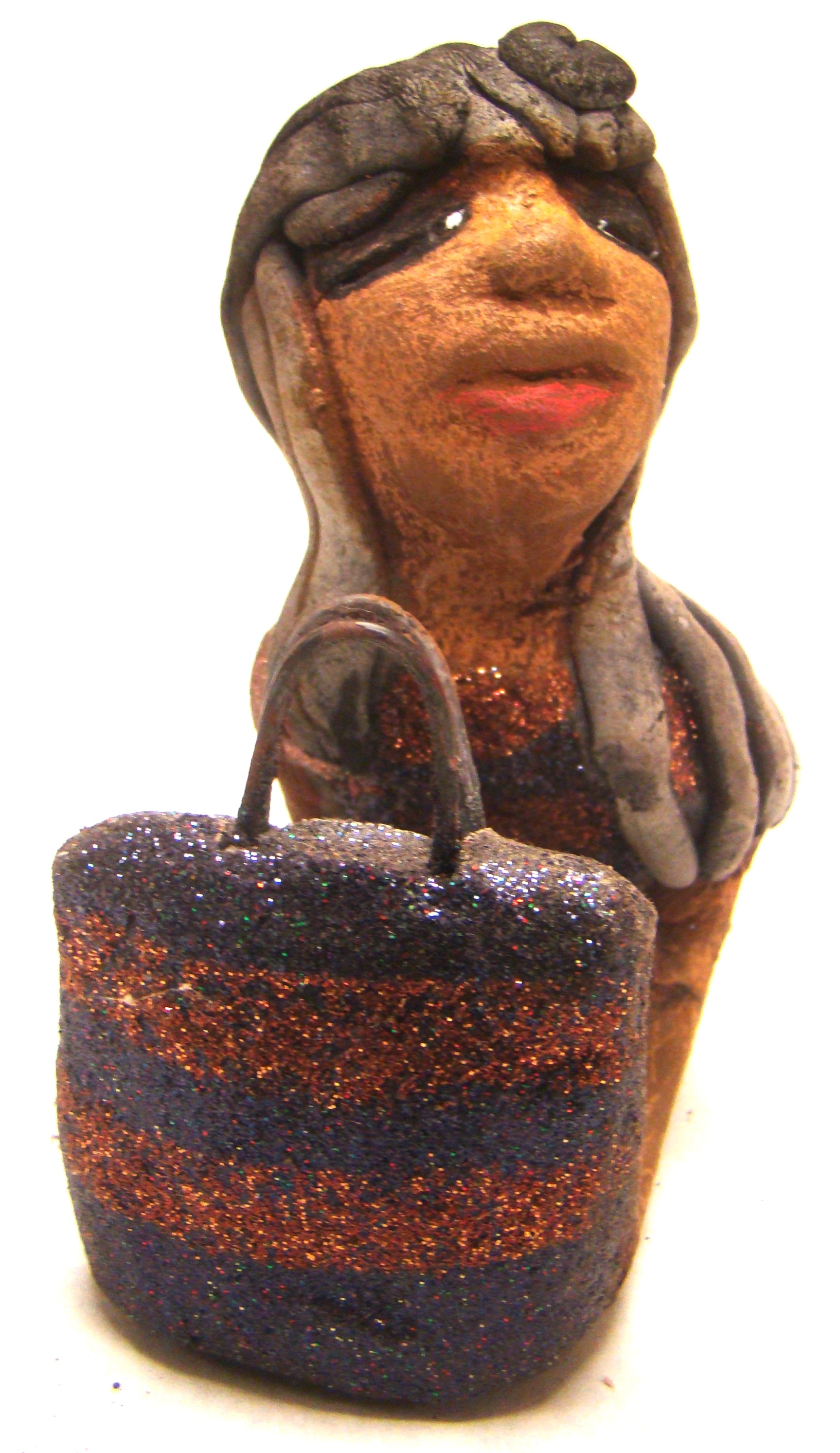 Wanda is Wishing and a Waiting !       Wanda stands 6" x 2.5" x 6" and weighs 11 ozs.     She has a lovely honey brown complexion with smokey gray clay hair.     Wanda's copper and green striped dress matches her bag.     Her long loving arms are outstretched with bag in hand.  Wanda is wishin and a waiting on You!