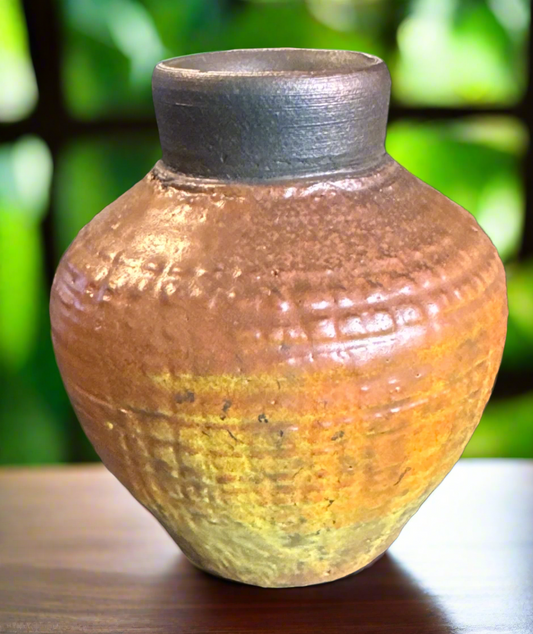 Introducing our exquisitely crafted Yellow Orange Textured Pot, measuring at 4 1/2 x 4 x 4 inches and featuring a stunning 2 inch opening. This luxurious raku fired vessel will add a touch of sophistication and exclusivity to any space.