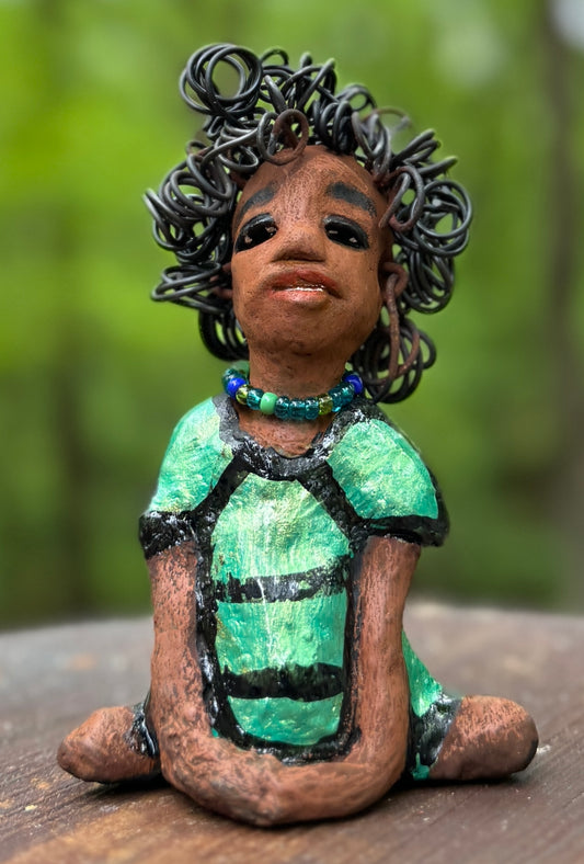 <span>Meet Anza, the brave figurine standing at 6" x 4" x 3" and weighing only 10 ozs. Adorned in a striking striped dress and with her hair styled in a regal coil, Anza represents adventure and determination as she relaxes in a yoga pose, exuding curiosity. Join the Herdew Collection today for the rush of free shipping and our easy return policy. Don't let this unique piece slip away! <br></span> <p>&nbsp;</p>
