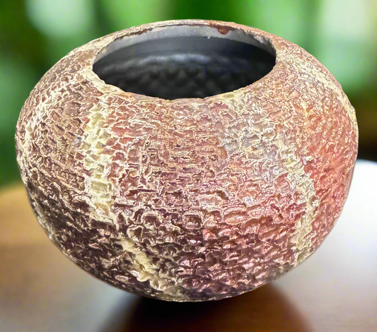 This textured copper beige strip vase adds a unique touch to any space. With a 4 inch height and 6 inch width and depth, this 1 pound and 2 ounce vase is the perfect size for displaying flowers or other decorative items. The unglazed interior adds to its natural and rustic charm.