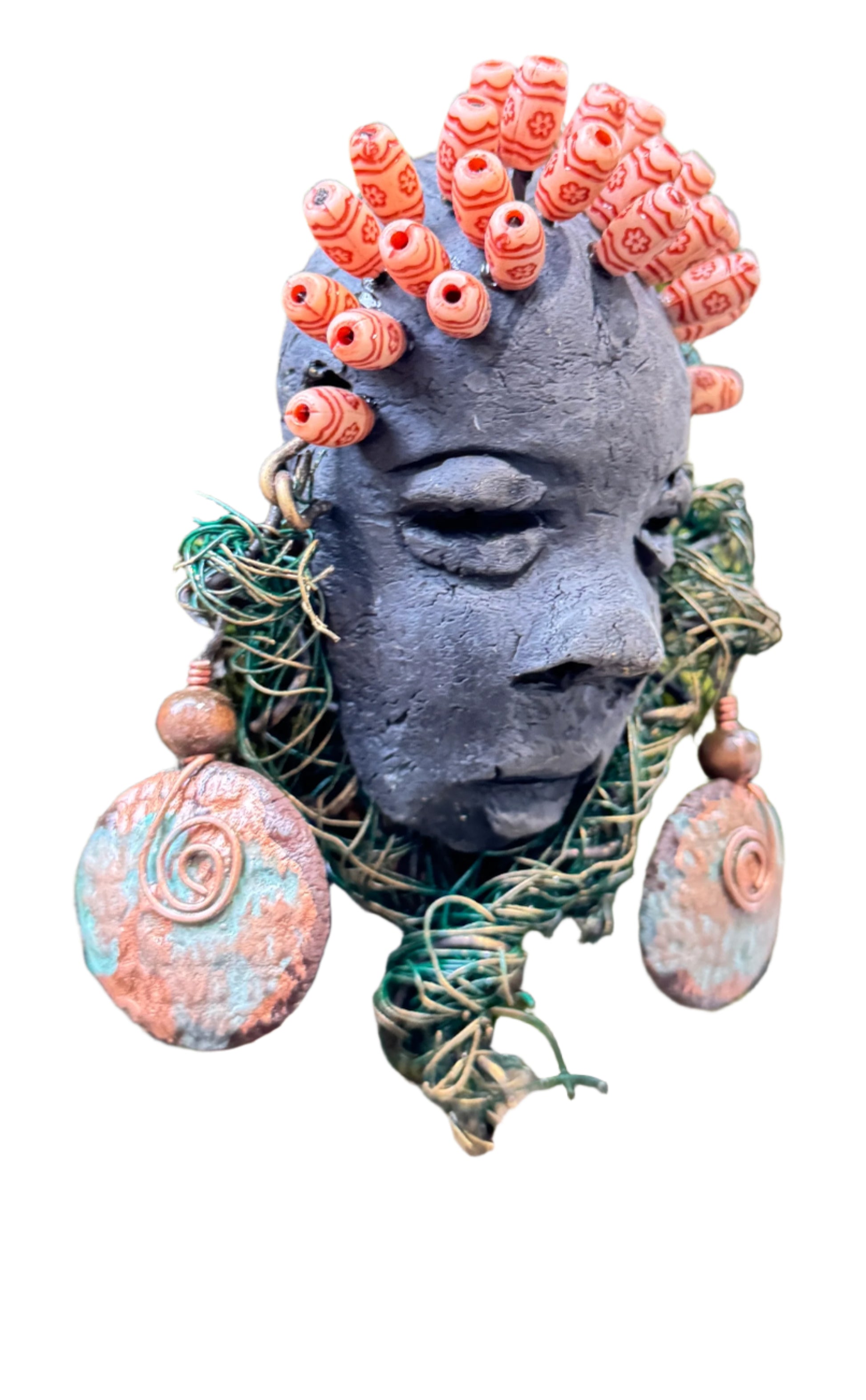 Catto is a 4” x 6” 6oz. mixed media raku fire mask made with 25 feet of 24 and 16 gauge wire. It has a stunning Smokey black complexion and comes with a large Raku fired earring and a wooden bead headdress. This makes Catto a lovely addition to your HerDew mask collection.