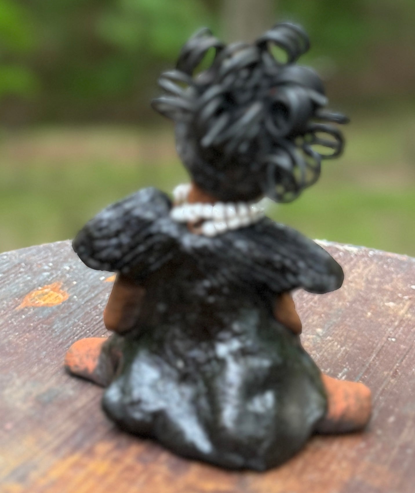 Say hello to Ama, the daring figurine standing at 5" x 4" x 3" and weighing a mere 10 ozs. Adorned in a striking black dress and with her coiled hair as her crown, Ama exudes boldness with a birth mark and bravery as she sits in a yoga pose, radiating curiosity. Embark on an adventure with the Herdew Collection and feel the exhilaration of free shipping and our customer-friendly return policy. Don't let this unique piece slip away!