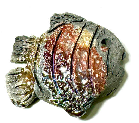 Measuring 1" x 1" x 1", this raku fire fish magnet weighs a mere 0.8 oz and is sure to draw attention from any viewing angle with its vibrant homemade iridescent glazes. An ideal addition to any collection, this ceramic piece is a perfect size for display.