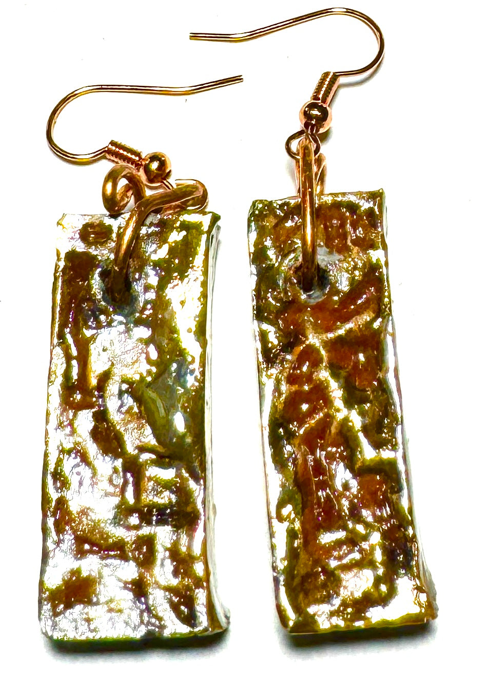 Take a daring fashion risk with the ER-15 earrings! These lightweight rectangle earrings feature a unique shimmery copper luster that adds an eye-catching sparkle to any look. Delicately crafted at 1/2 ounce, they're designed to go anywhere. Be bold and make a statement!