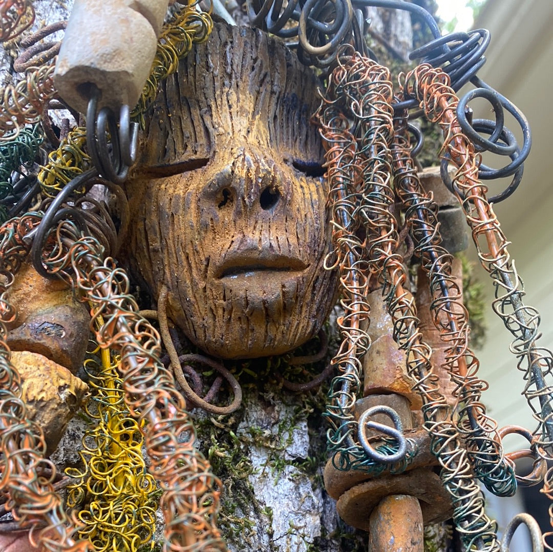 Vetti is 6”x8 ” and weighs 4.6 ozs. She has a two tone copper brown complexion. Vetti has big hair with several spiral coils handmade Raku beads. Over 30 ft of hand twisted 16 and 24 gauge wire!