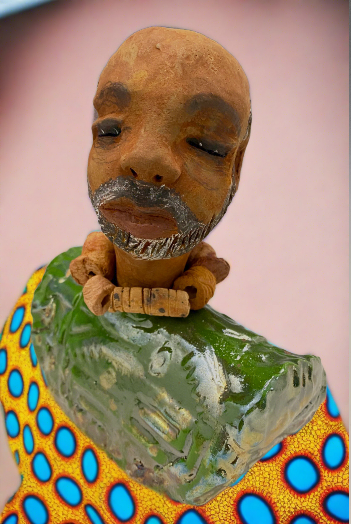 Albert measures 7.5" x 6" x 3" and weights 2.5lbs.<br>He is dressed in a metallic copper green dashiki.<br>He is partially bald, sporting a salt and peppered beard.<br>He is unique within the Herdew collection! Albert is the perfect size and weight for easy portability. His stylish outfit ensures he always stands out in the crowd. He's sure to be the talk of your collection!