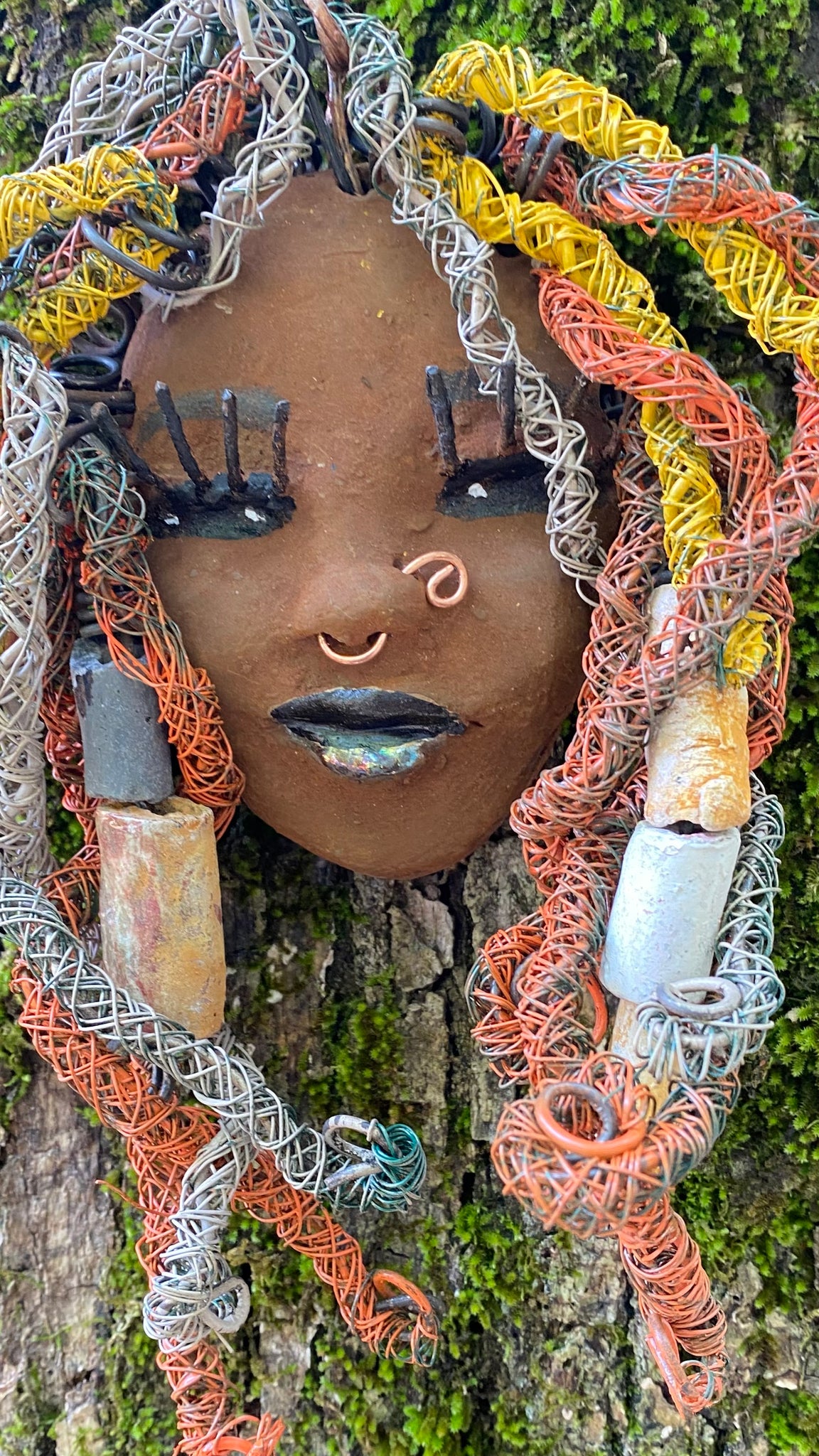 Introducing Nala, the 5" x 7" whimsical mask with a cocoa copper complexion. Its handmade textured dreadlocks and coiled 16 gauge wire provide a unique look that's not found in typical masks. Nala is the perfect conversationalist for your wild inquiries, so don't hesitate - give her a shout! My art journey began after I visited the Smithsonian Museum of African Art, and I was inspired to create Nala.