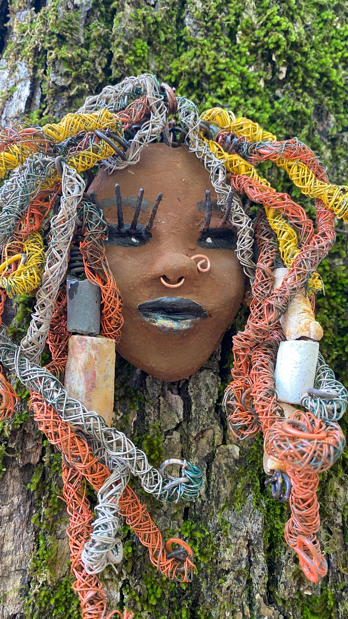Introducing Nala, the 5" x 7" whimsical mask with a cocoa copper complexion. Its handmade textured dreadlocks and coiled 16 gauge wire provide a unique look that's not found in typical masks. Nala is the perfect conversationalist for your wild inquiries, so don't hesitate - give her a shout! My art journey began after I visited the Smithsonian Museum of African Art, and I was inspired to create Nala.