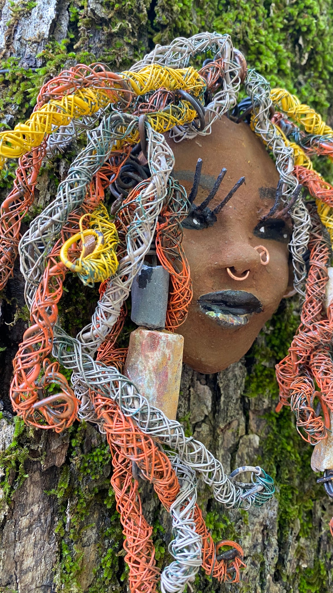 Introducing Nala, the 5" x 7" whimsical mask with a cocoa copper complexion. Its handmade textured dreadlocks and coiled 16 gauge wire provide a unique look that's not found in typical masks. Nala is the perfect conversationalist for your wild inquiries, so don't hesitate - give her a shout! My art journey began after I visited the Smithsonian Museum of African Art, and I was inspired to create Nala.