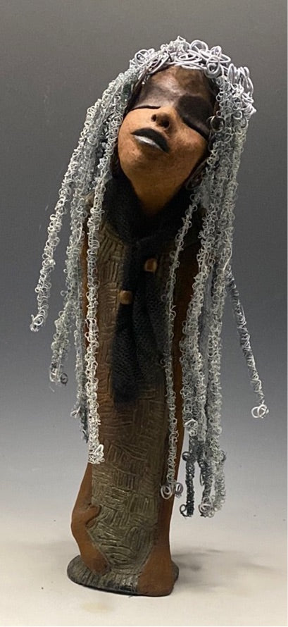 Yvette is one of my BIG girls who wants to understand what's going on!  She stands 18" x 5.5" x 4.5" and weighs 4 lbs. She wears an etched textured copper dress with a black tulle scarf.  