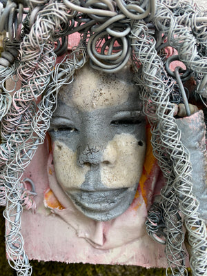 Bring a bit of quirk to your walls with Venice! This one-of-a-kind folk art piece is mounted on a painted 5”x 6” wood canvas and features over 40 feet of wired hair and Raku beads! With white , antique crackle face and lips, she is sure to liven up any space. Whether you want a conversation starter or just an eye-catching piece of art, Venice is ready to be hung! Got questions? Just ask!Got Questions??  