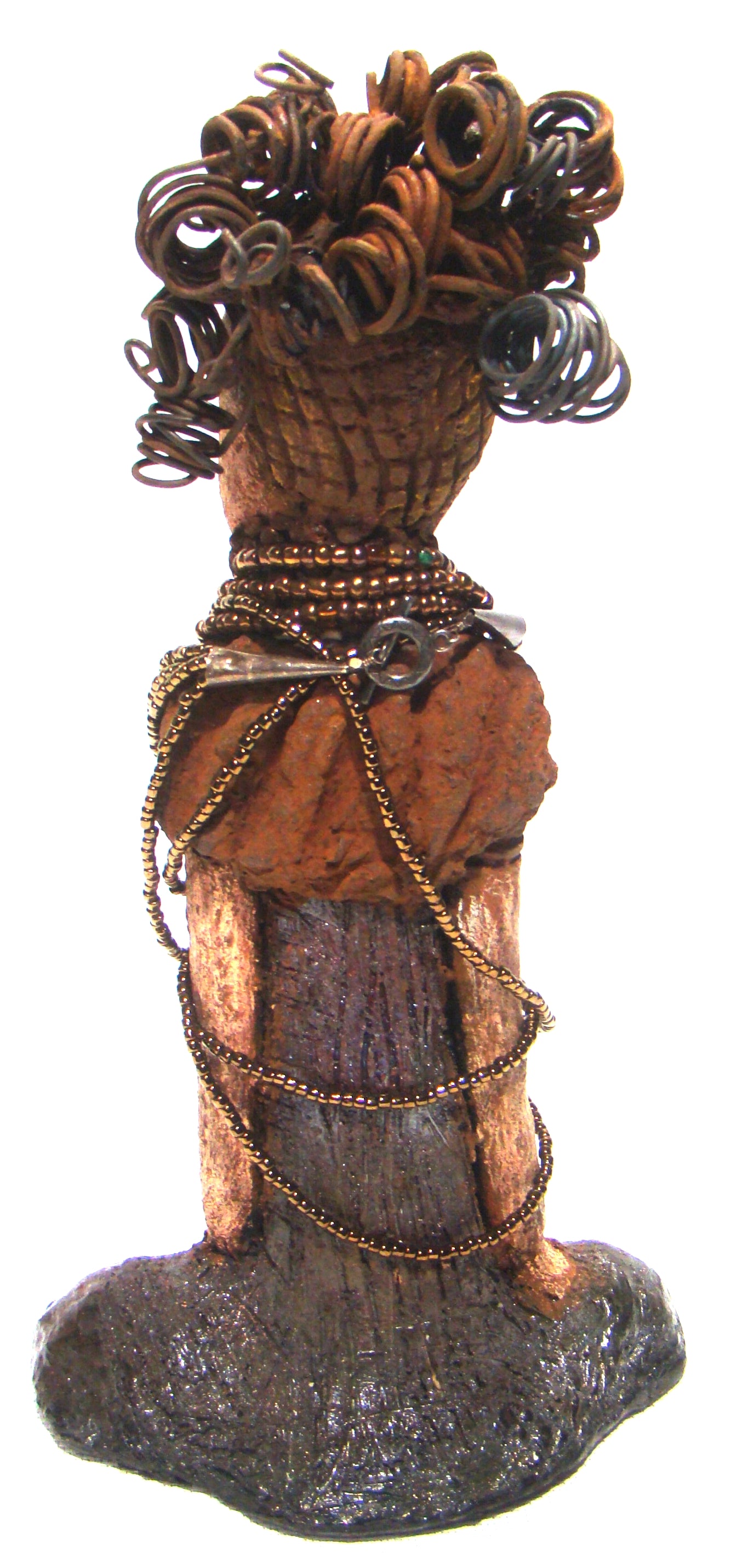 Cardi stands 11" x 5.5" x 3" and weighs 1.14 lbs. She has an awesome two tone honey beige complexion. Cardi wears a dark metallic copper dress with a chocolate ruffle scarf.  She wears a multitude of amber colored hand strung beads. I do believe Cardi would like it if you gave her a space in your home!