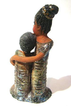 Girl Talk with my Mom stands 13' x 7" x 4" and weighs 14.lbs. They were raku fired etched metallic copper dresses. Their hair is made of clay and raised into an etched bun. They have lovely honey brown complexions and long loving arms. Girl Talk with my Mom would remind one of those special moments in tim