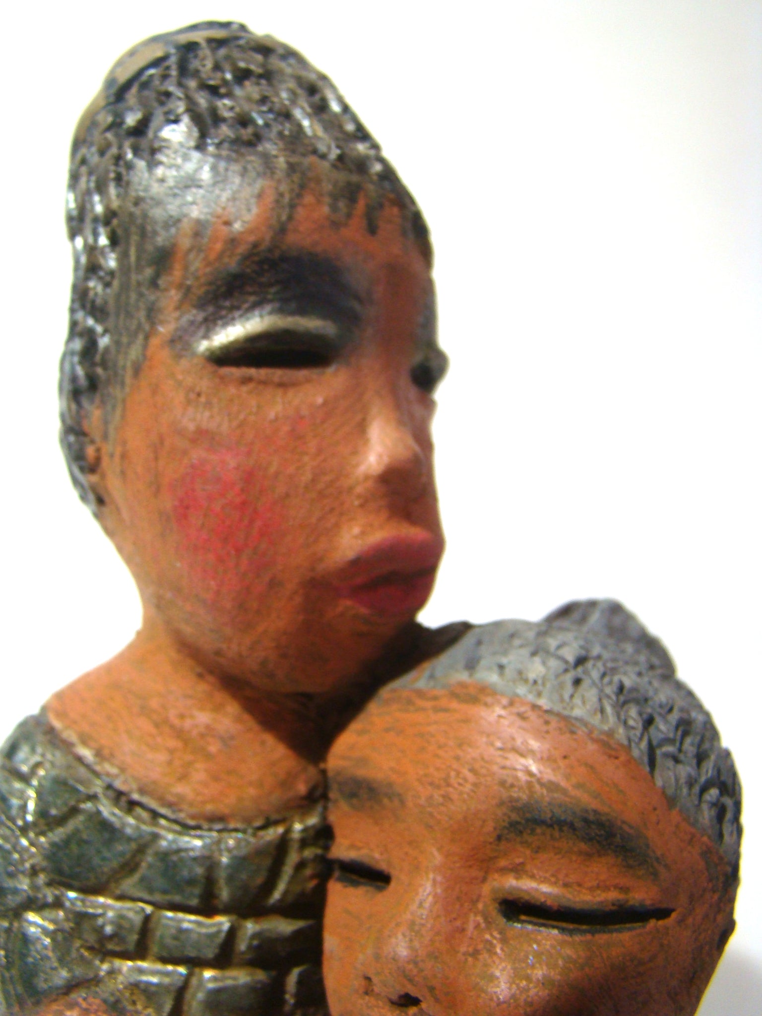 Girl Talk with my Mom stands 13' x 7" x 4" and weighs 14.lbs. They were raku fired etched metallic copper dresses. Their hair is made of clay and raised into an etched bun. They have lovely honey brown complexions and long loving arms. Girl Talk with my Mom would remind one of those special moments in tim