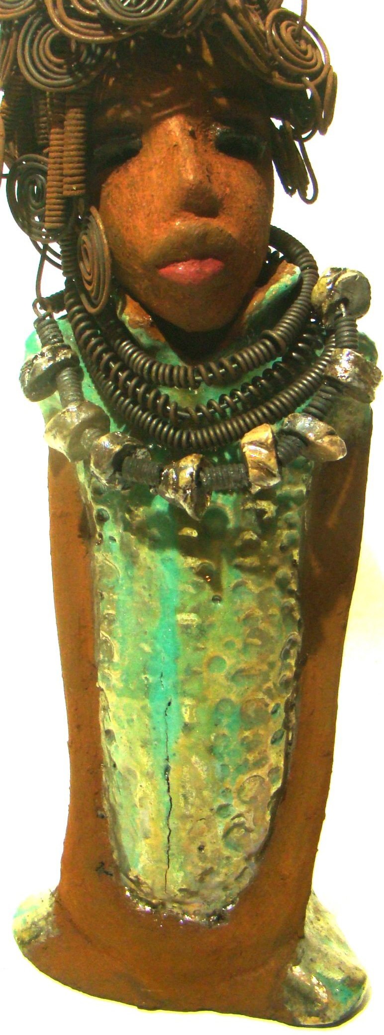 Martina stands 13" x 5" x 4" and weighs 3.15 lb. She wears a large beaded coiled collared necklace. Martina wears a metallic green gold textured dress. Martina has an awesome honey brown complexion that compliments her subdued look. She has those familiar long loving arms! Martina is looking for a new home. She is a conversation piece. Free Shipping!