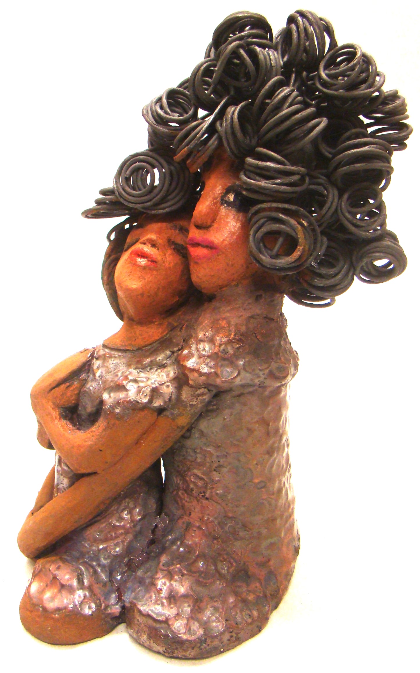 I Love You More stands 8.5 " x 4.5" x 4".5" and weighs 2.10 lbs. They have lovely honey brown complexions. Combined, I Love You More has over 25 feet of curly wire hair. They have glossy metallic copper dresses. They have long loving arms. One  is embracing the other. I Love You More! will  help illustrate the love that is in your home! Free Shipping!