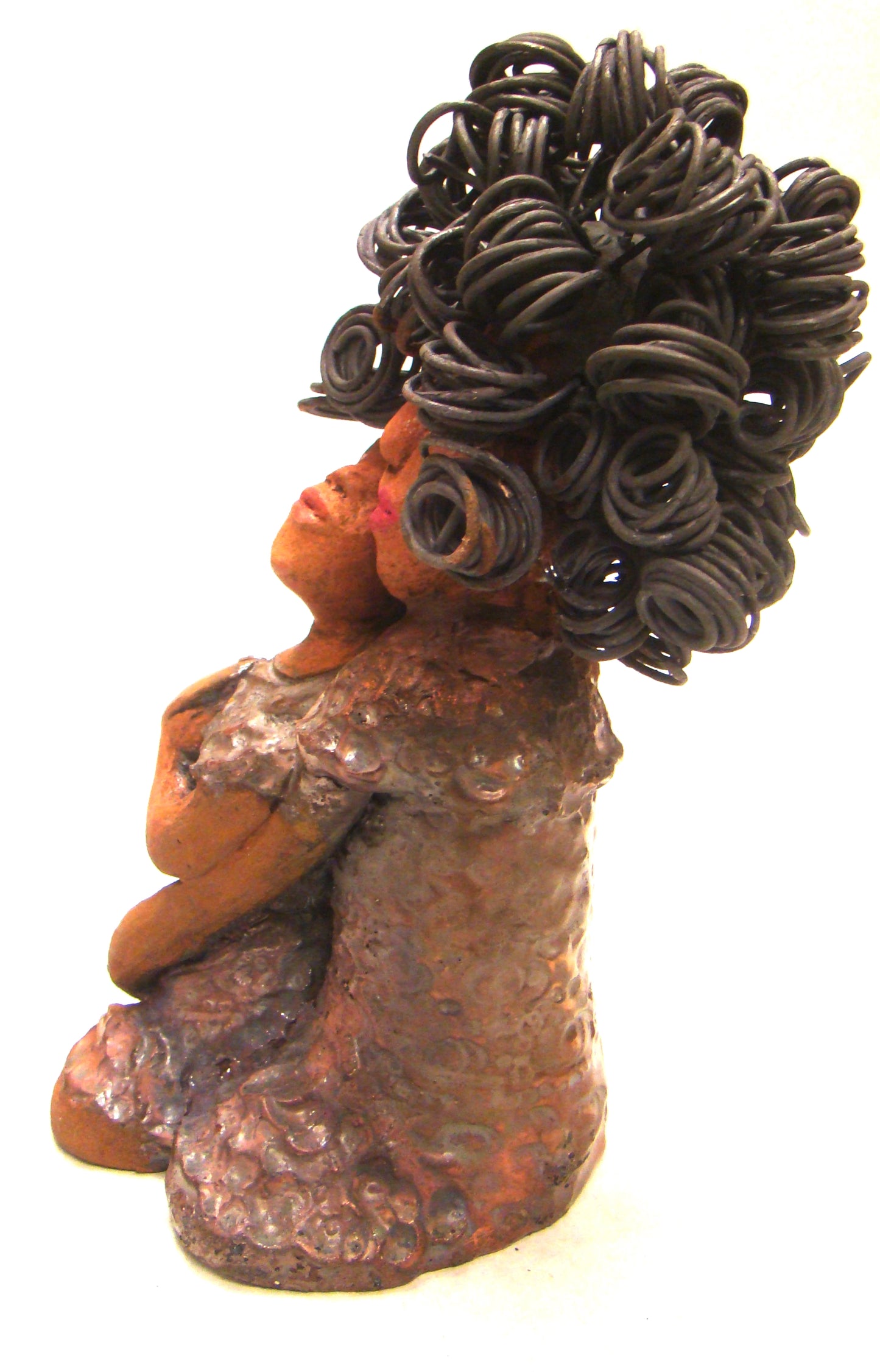 I Love You More stands 8.5 " x 4.5" x 4".5" and weighs 2.10 lbs. They have lovely honey brown complexions. Combined, I Love You More has over 25 feet of curly wire hair. They have glossy metallic copper dresses. They have long loving arms. One  is embracing the other. I Love You More! will  help illustrate the love that is in your home! Free Shipping!