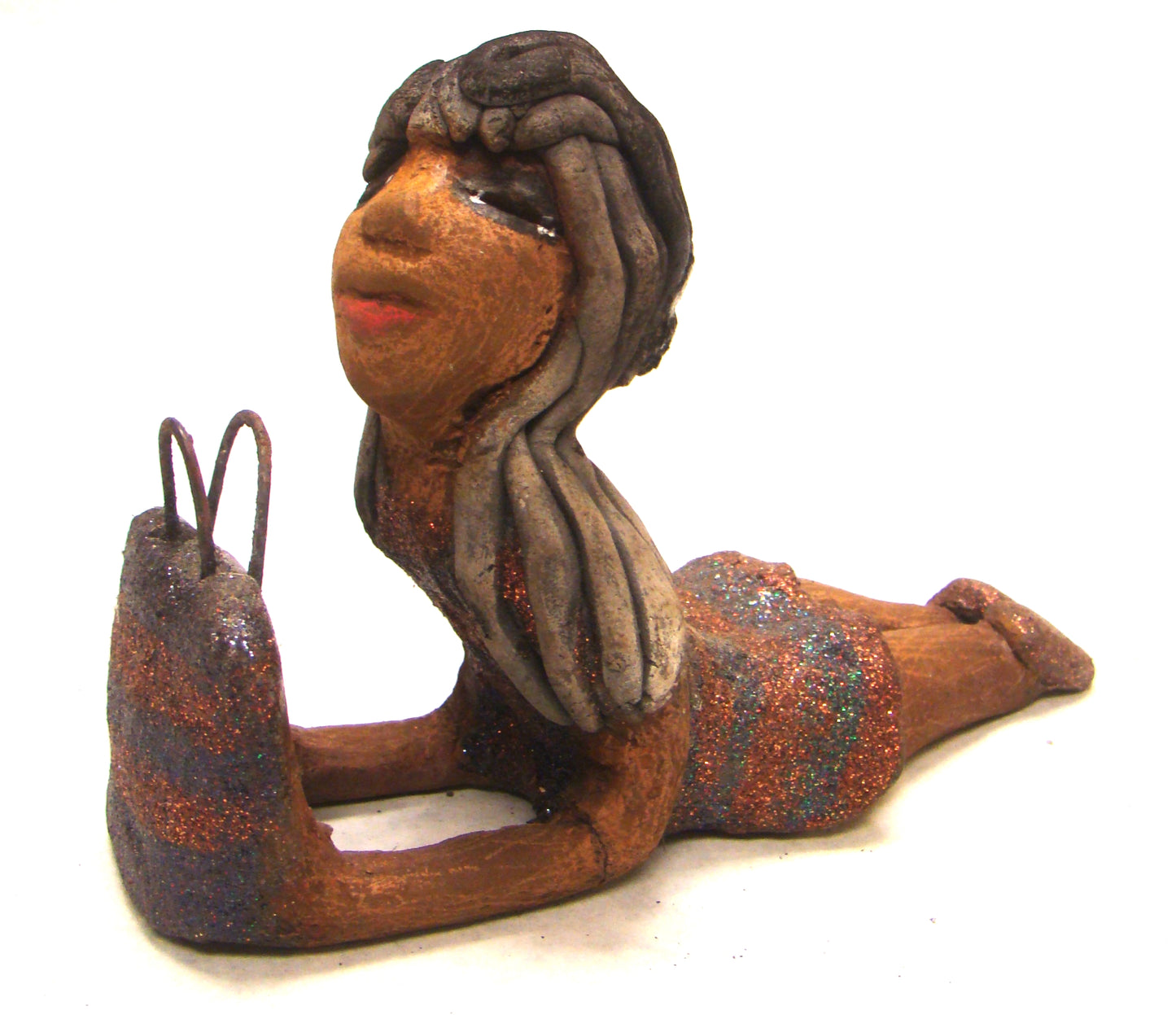 Wanda is Wishing and a Waiting !       Wanda stands 6" x 2.5" x 6" and weighs 11 ozs.     She has a lovely honey brown complexion with smokey gray clay hair.     Wanda's copper and green striped dress matches her bag.     Her long loving arms are outstretched with bag in hand.  Wanda is wishin and a waiting on You!