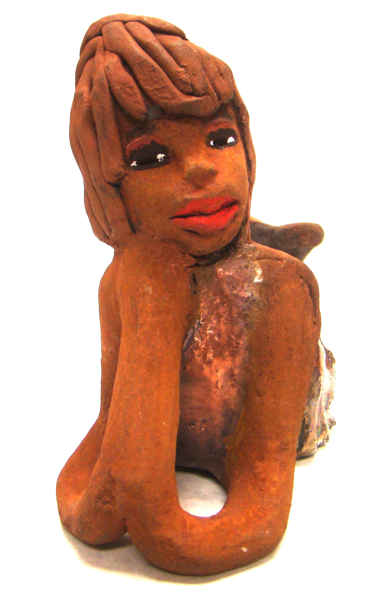     Ada stands 6" x 3.5" x 7.5" and weighs 1.11 lbs.     Ada has a lovely honey brown complexion with ruby red lips..     Her long loving arms are underneath her face as she ponders.     Ada dress is a copper glazed and she has hair made of clay.     Ada is bright eyed and ready to be placed in a good home.