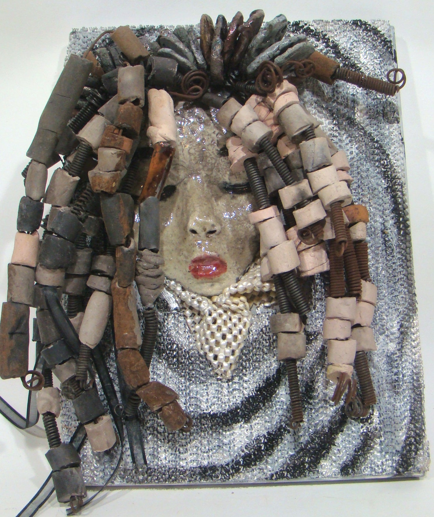     She has over 30 feet of 16 gauge wire for hair and over 60 raku beads.     Reagan has a white crackle face with ruby red lips.     She is ready to be hung!