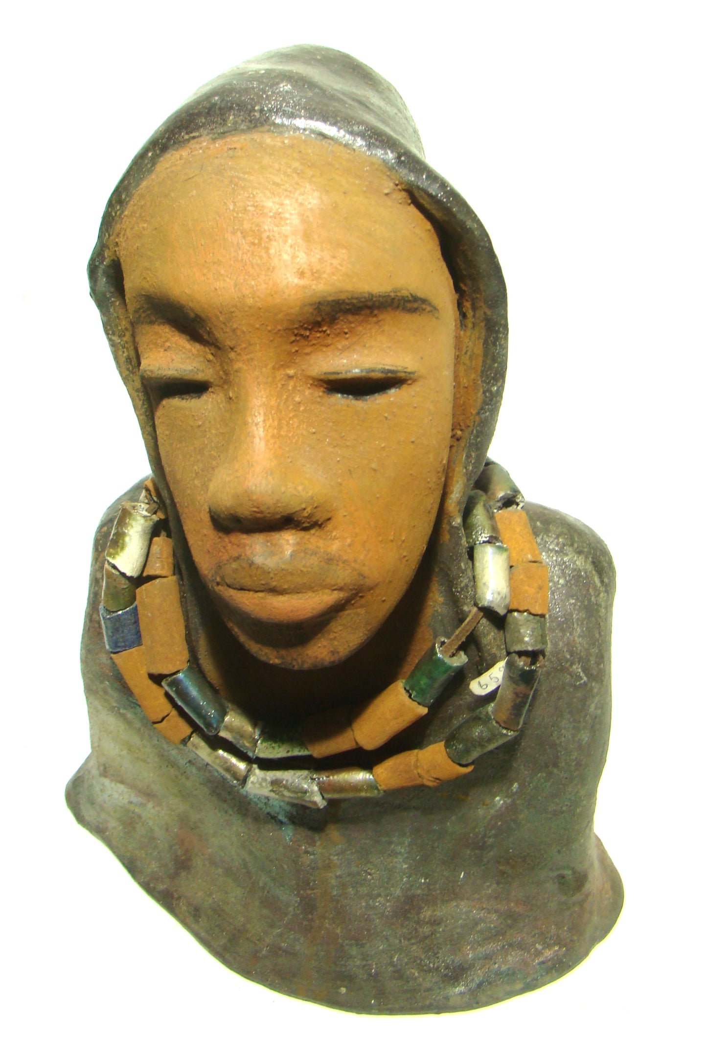 Carlos stands 15" 10" x 7" and weighs 6.13 lbs. He wears a metallic multi colored hoodie with earthy raku beads. Carlos has a honey brown complexion. He seems to be in deep thought. Carlos would add gentleness to that special place in your home.