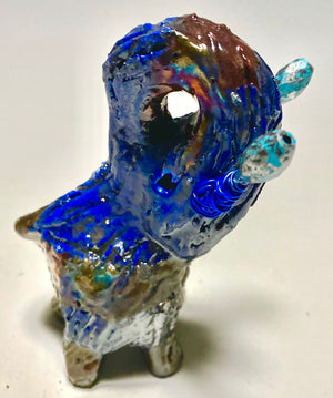 Raku Elephant Have you HERD!!!!!!  Just one of these lovely Raku Fired Elephant will make an excellent gift for your  friend, sorority or for your home’ special place centerpiece.  5" x 4" x 4" 9 ozs. Blue wire beaded blue tusk Beautiful metallic raku colors For decorative purposely only.