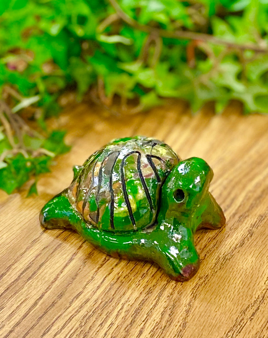 Boys, girls, men, and women of all ages talked about how cute they are. They got a kick out of and adored the turtles that were named after someone they knew". Tommie is 2" x 2" x 4" and weighs 5.8 ozs. Tommie has a glossy green and copper complexion. Tommie is ready to Go!!