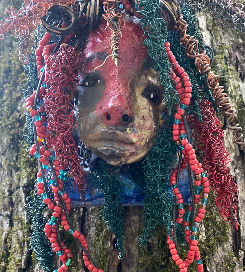 Aerie is mounted on a 4"x 6" painted wood canvas. I spent about 2 hours or more just fixing Aerie hair and attaching beads!  Aerie has over 80 feet of 24 and 16 gauge wire for hair. Aerie has a silver red and antique copper crackle face and lips. Aerie  is ready to be hung!