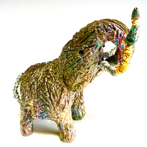 Raku Elephant Have you HERD!!!!!!  Just one of these lovely Raku Fired Elephant will make an excellent gift for your  friend, sorority or for your home’ special place centerpiece.  5" x 4" x 5" 10 ozs. Beautiful copper metallic raku elephant Copper and silver  beaded tusk For decorative purposely only.