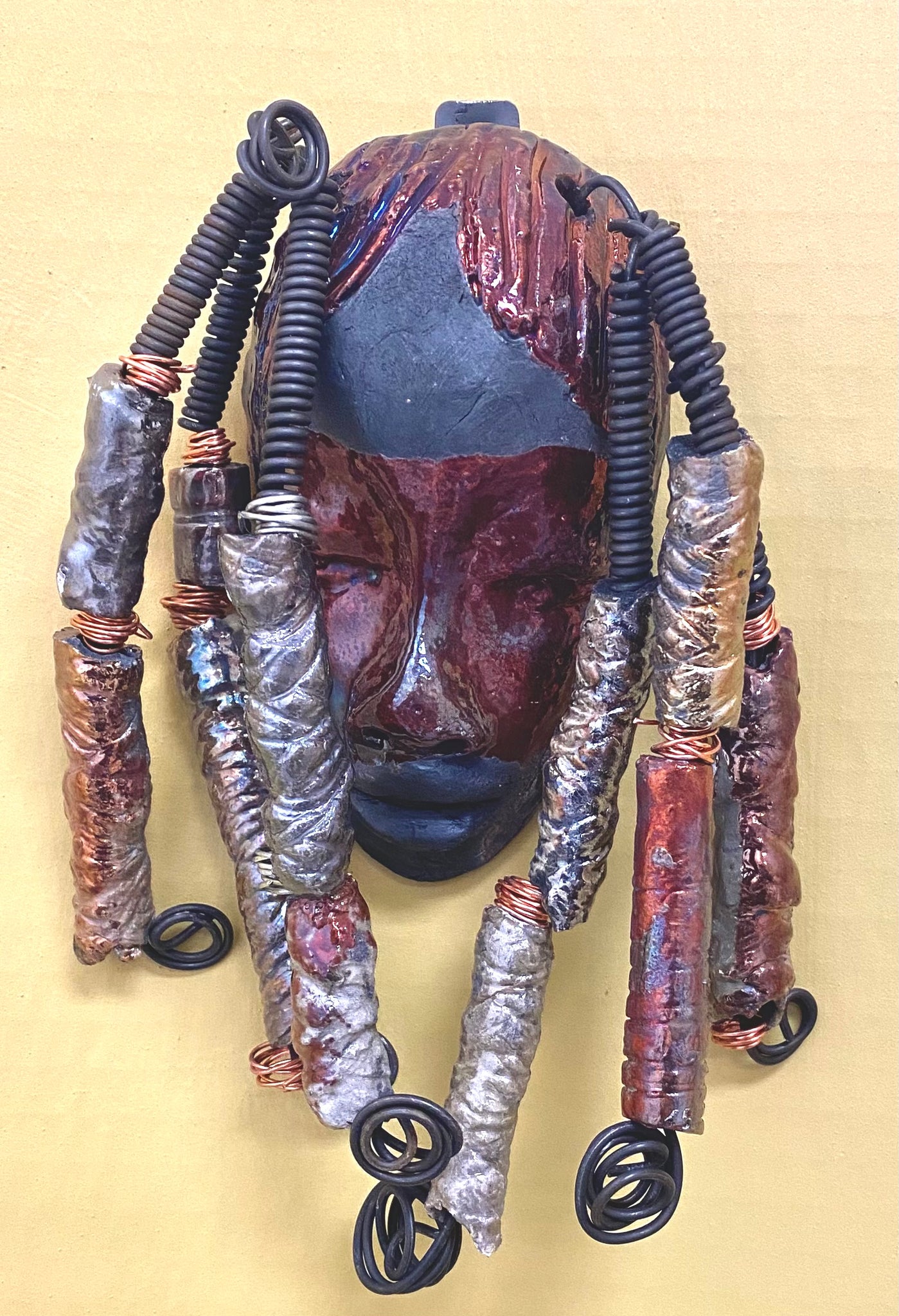 Keita " earnest provider" was inspired by my visit there.  Keita is 4”x 8” and weighs 3.6 ozs. She has a two tone copper and black  complexion. Keita has six spiral coils of hair. She is ready to be installed in your home!