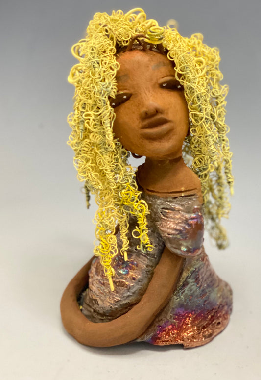 Valorie stands 8" x 4.5" x 4.5" and weighs 1.05 lbs. She has a lovely honey brown complexion with cocoa brown lips. She has long twisted wire locs hairstyle waist down!  Valorie has a metallic  copper antique glazed dress. She has over 75 feet of 16 and 24 gauge  pale yellow wire for hair. It took over 7 hours just to do her hair! With  eyes wide opened, Valorie has hope of finding a new home.   
