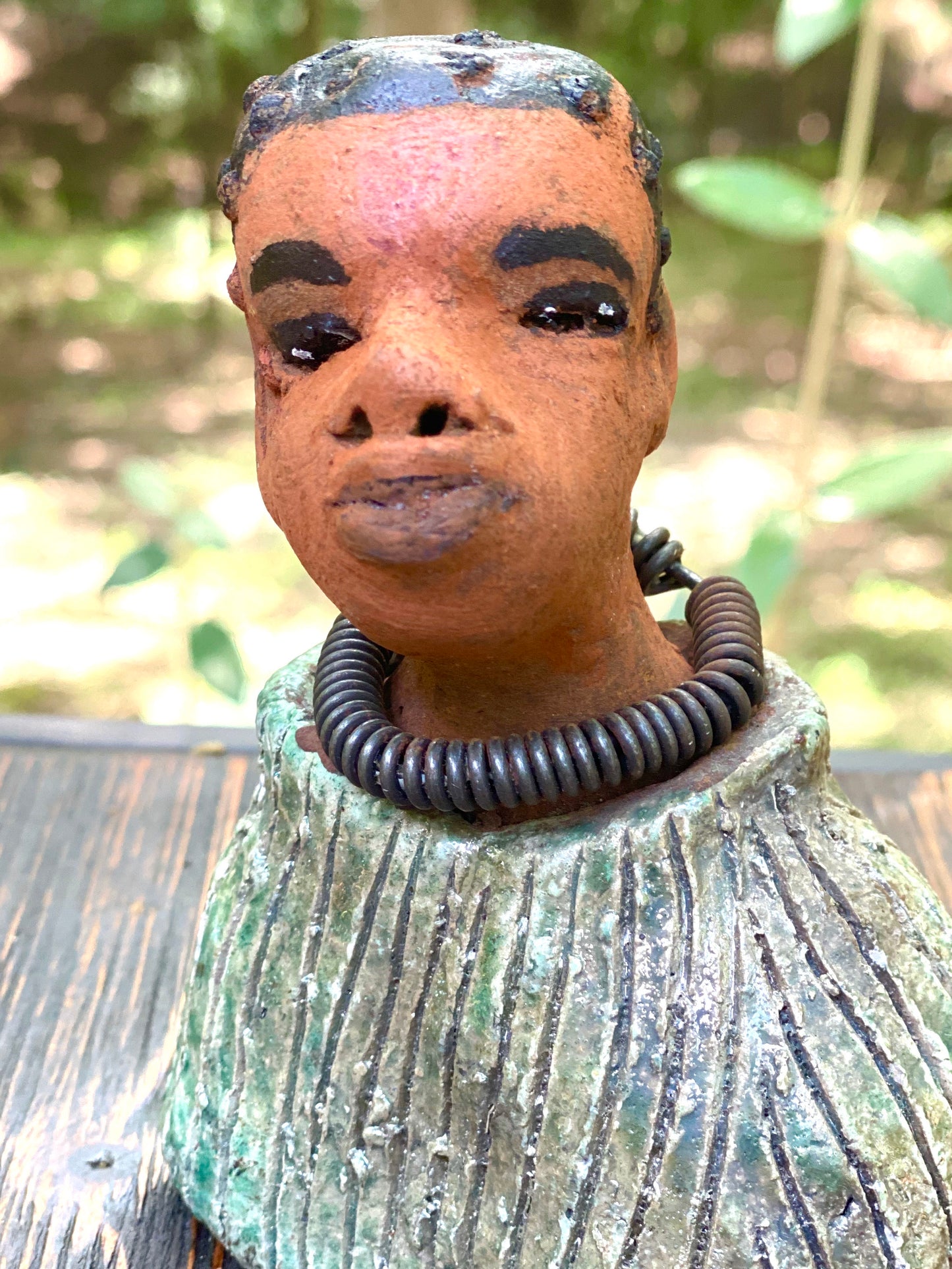 "It is obvious Herdew implies that most of my sculptures are female. My goal this year is to create ten male sculptures. Alvin is one of the first that I am pleased with. Pete stands 5" x 4" x 3" and weighs 10 ozs. He wears an etched metallic multi colored jacket with a cioled wire necklace. Pete has a honey brown complexion. Pete seems to be in deep thought about ﻿﻿his next move in life. Pete  would display proudly in your home.