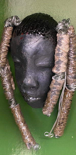 Meet Abbas! I started making art soon after seeing authentic African artwork at the Smithsonian Museum of African Art. I was in total awe.  Abbas was inspired by my visit there.   Abbas  4" x 7" and weighs 8.6 ozs. Abbas's face is a lovely smoky black. She has nine textured beads that are off white dread locks.