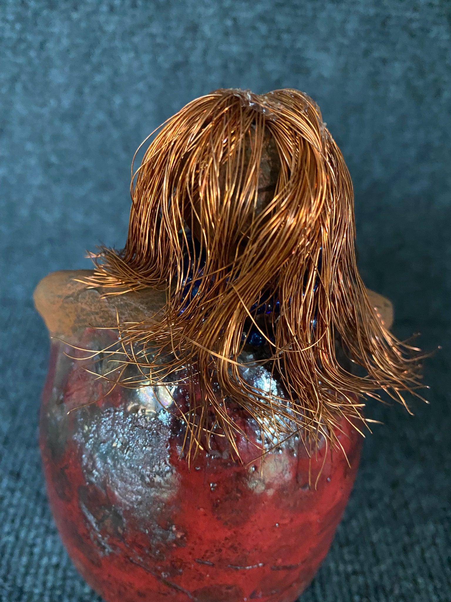 ﻿Meet Dora!  She is a big girl who loves to sing and has aspirations of becoming a  movie star.  Dora stands 7" x 4" x 4.5" and weighs  1.06 lbs.  She has a lovely honey brown complexion with lovely reddish brown lips.  Dora has a lovely gold spotted heart glazed dress.  She wears a beaded  dark blue necklace.  With eyes wide opened, Dora has hopes of finding a new home.   Dora has a twin sister name Cora.