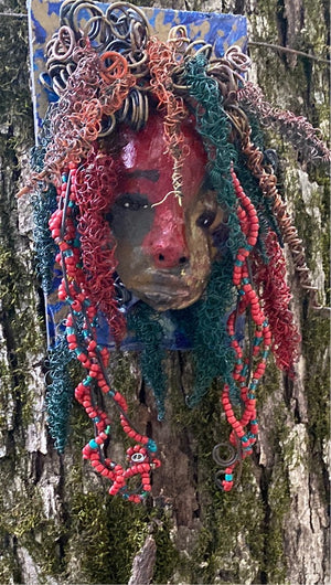 Aerie is mounted on a 4"x 6" painted wood canvas. I spent about 2 hours or more just fixing Aerie hair and attaching beads!  Aerie has over 80 feet of 24 and 16 gauge wire for hair. Aerie has a silver red and antique copper crackle face and lips. Aerie  is ready to be hung!