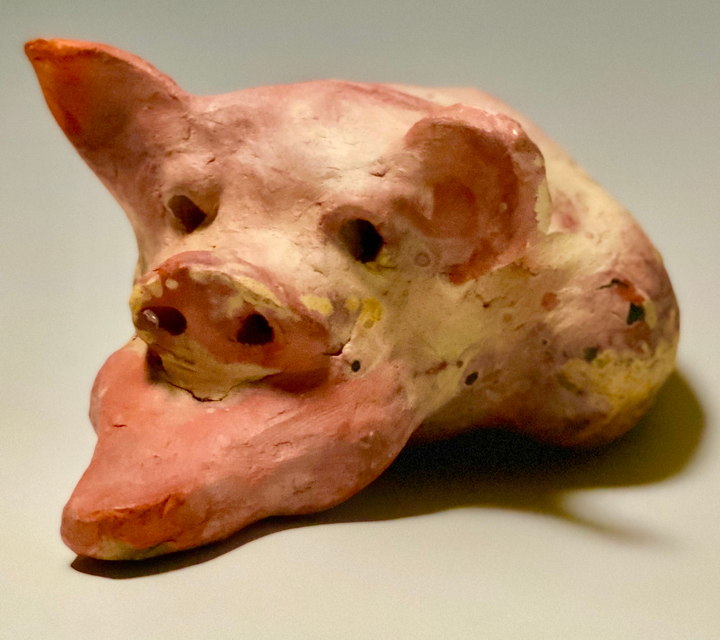 This Little Piggy named Mike is 4" x 5' x 6" and weighs 1.8 lbs. Mike has a matte and satin pinkish complexion. Mike little curly tail is made of wire.