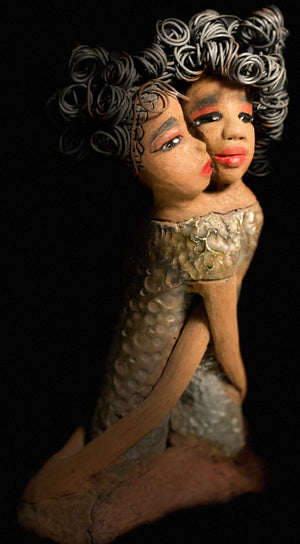 My BFF! My BFF stands 13" x 8" x 4" and weighs 4.13 lbs. Both girls have lovely honey brown complexions. Their dresses are textured and have copper metallic glazes. The long loving arms of My BFF embrace one another with love. My BFF has over 25 feet of curly 16 gauge wire hair. My BFF represents the close bond and friendship that has developed between all women of every race, ethnicity, and color. My BFF will make an excellent gift to your BFF