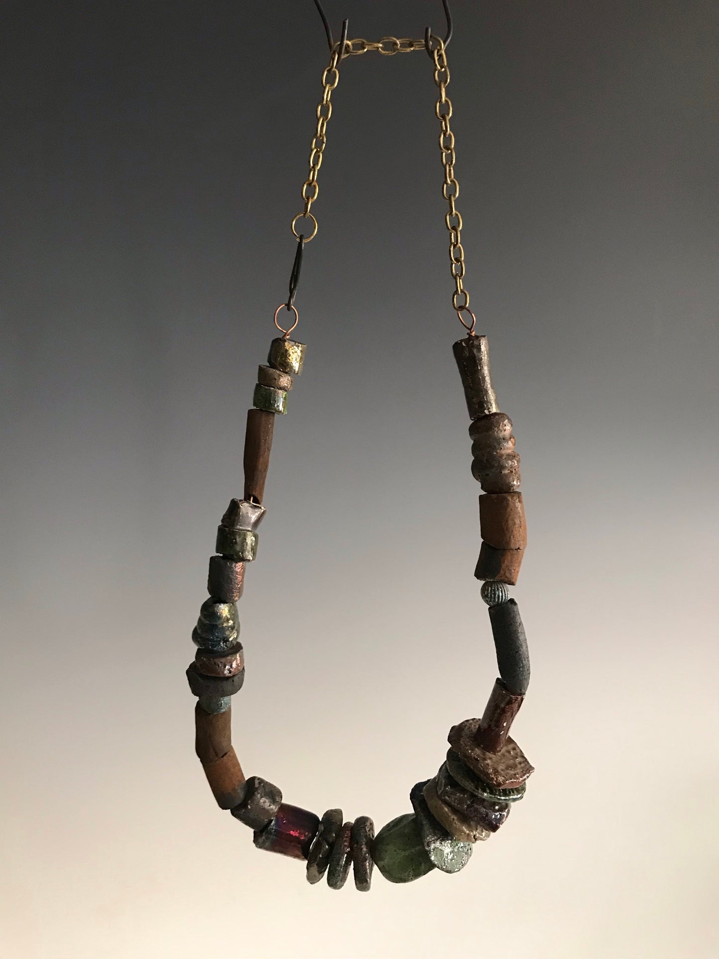 Nice!      30 handmade raku fired beads     26" in length with chain     5.2 oz