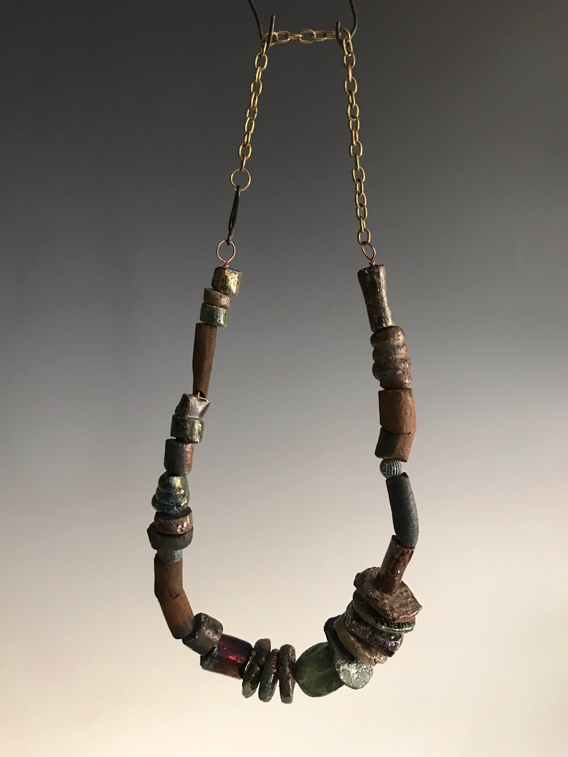Nice!      30 handmade raku fired beads     26" in length with chain     5.2 oz