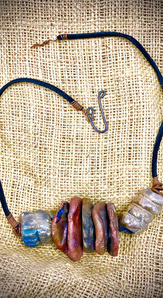 Simple and Beautiful! (7) metallic multi size /colored raku bead, (2 )  spiral wire beads. 7"  hang brown suede cord Amazingly Lightweight! 3.6 ozs!!
