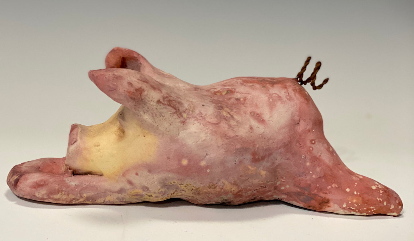 This Little Piggy named Olivia  is  approx. 4" x 5' x 6" and weighs 1.8 lbs. Olivia has a matte and satin pinkish complexion. Olivia little curly tail is made of wire.
