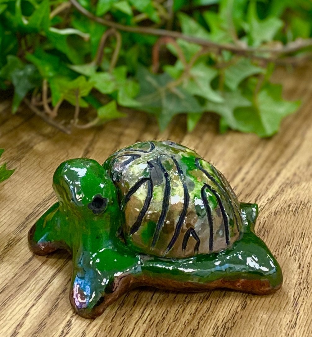 Boys, girls, men, and women of all ages talked about how cute they are. They got a kick out of and adored the turtles that were named after someone they knew". Tommie is 2" x 2" x 4" and weighs 5.8 ozs. Tommie has a glossy green and copper complexion. Tommie is ready to Go!!