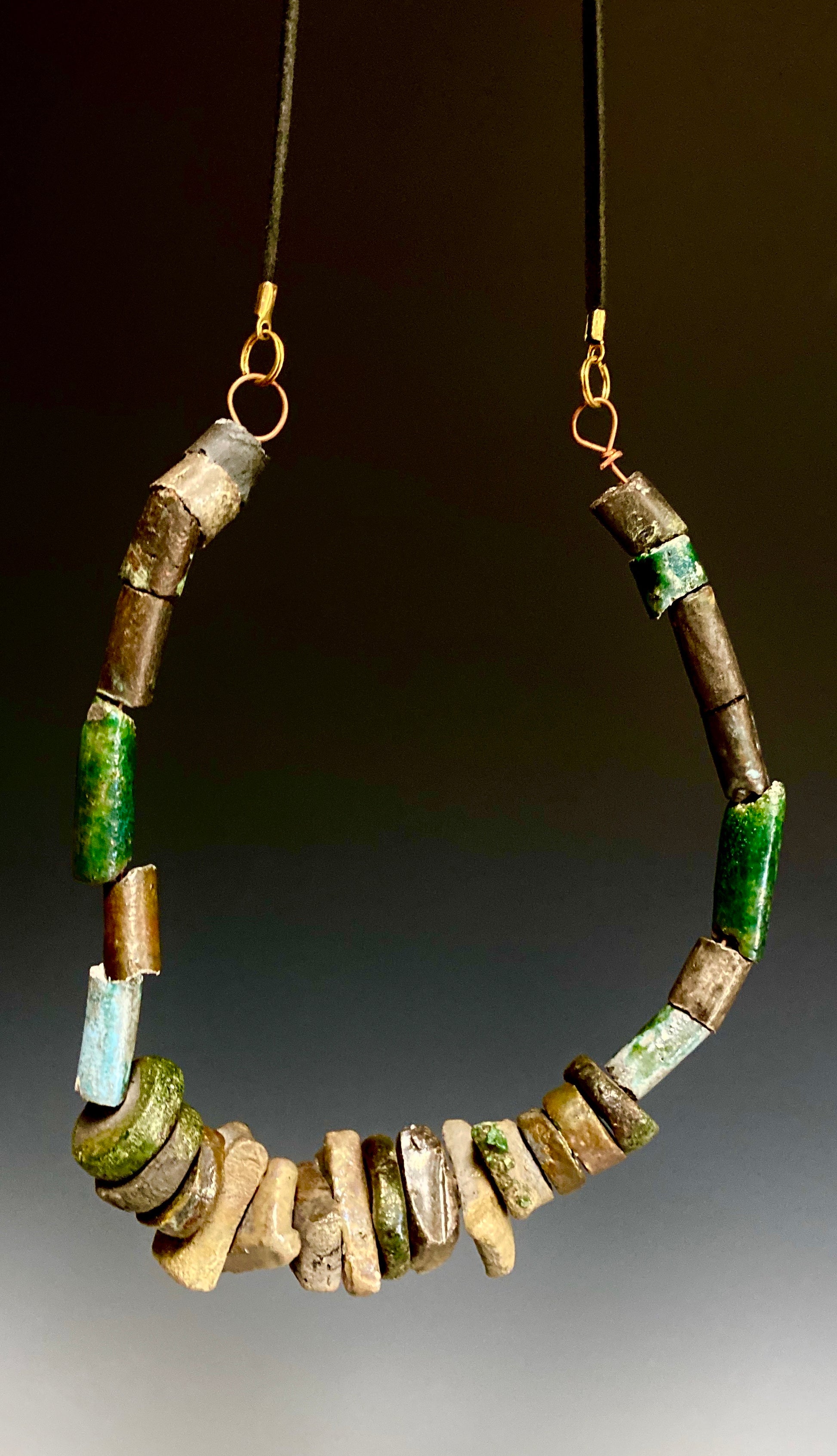 This one is really nice! 22” long 12" vertical drop  over 25 multi colored raku beads Tribal!