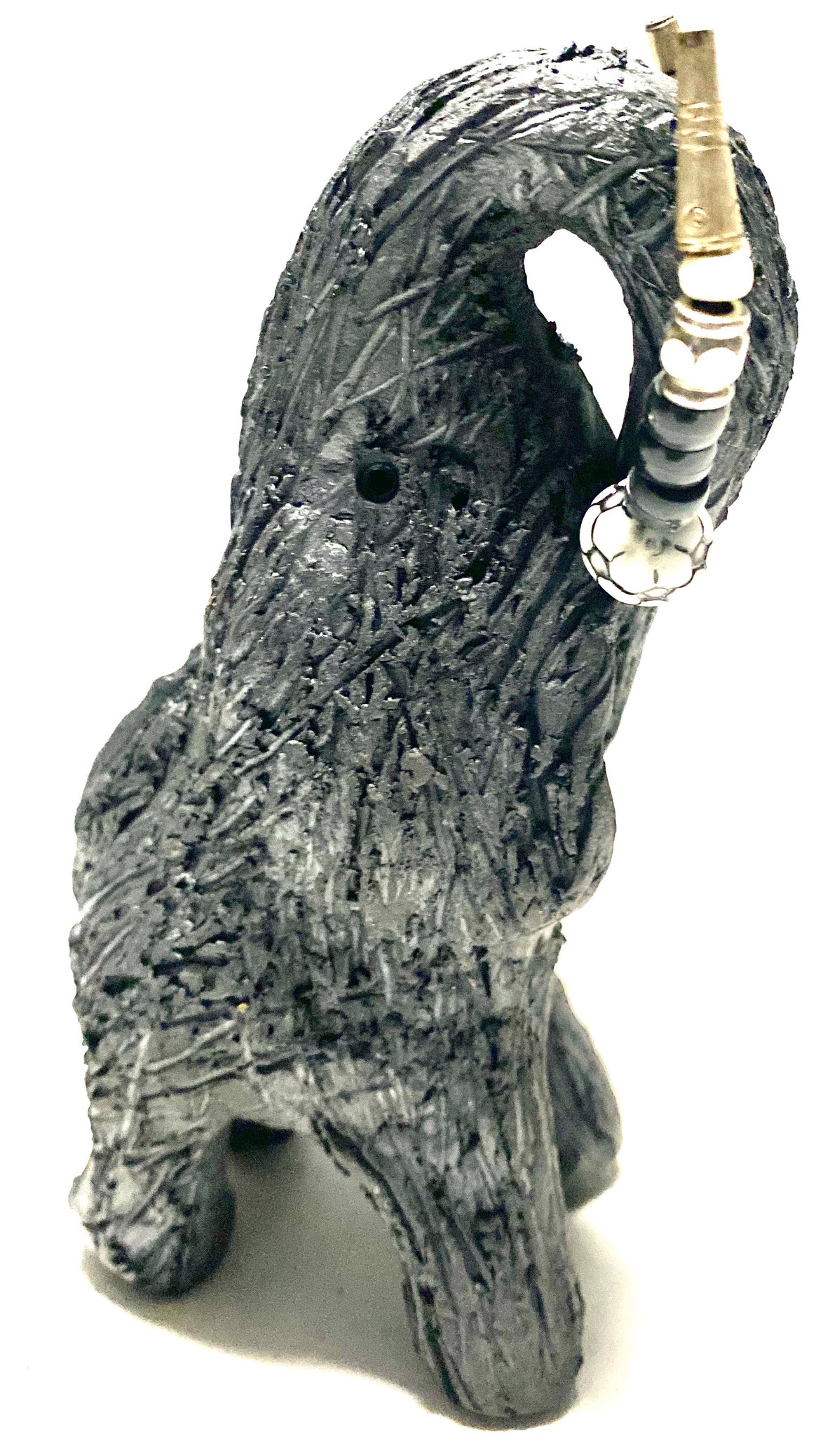 "Elephants are one of my favorite animals to create. They are so majestic" This raku fired elephant stands 7" x 2" x 2.5" and weighs 10 ounces. She has beaded tusks and a textured smokey black body. Nice! Great for a gift!