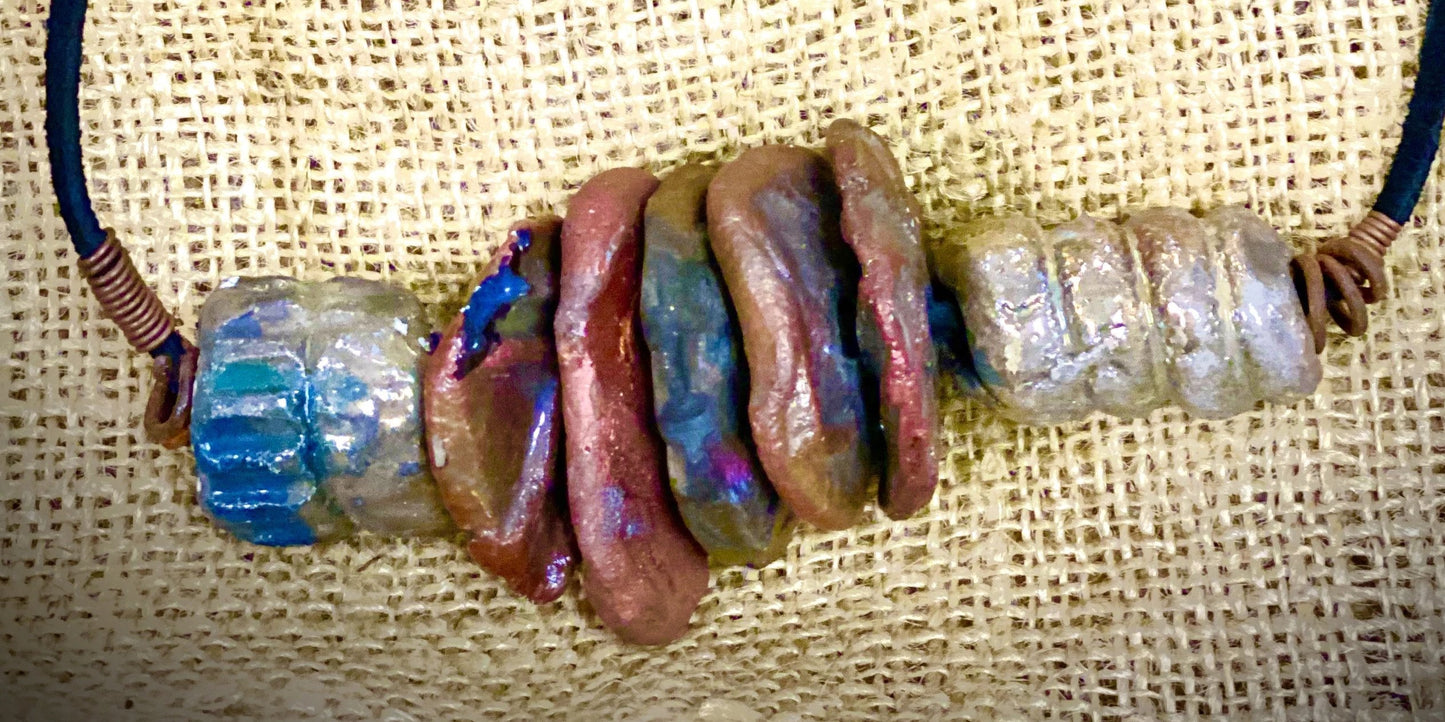 Simple and Beautiful! (7) metallic multi size /colored raku bead, (2 )  spiral wire beads. 7"  hang brown suede cord Amazingly Lightweight! 3.6 ozs!!