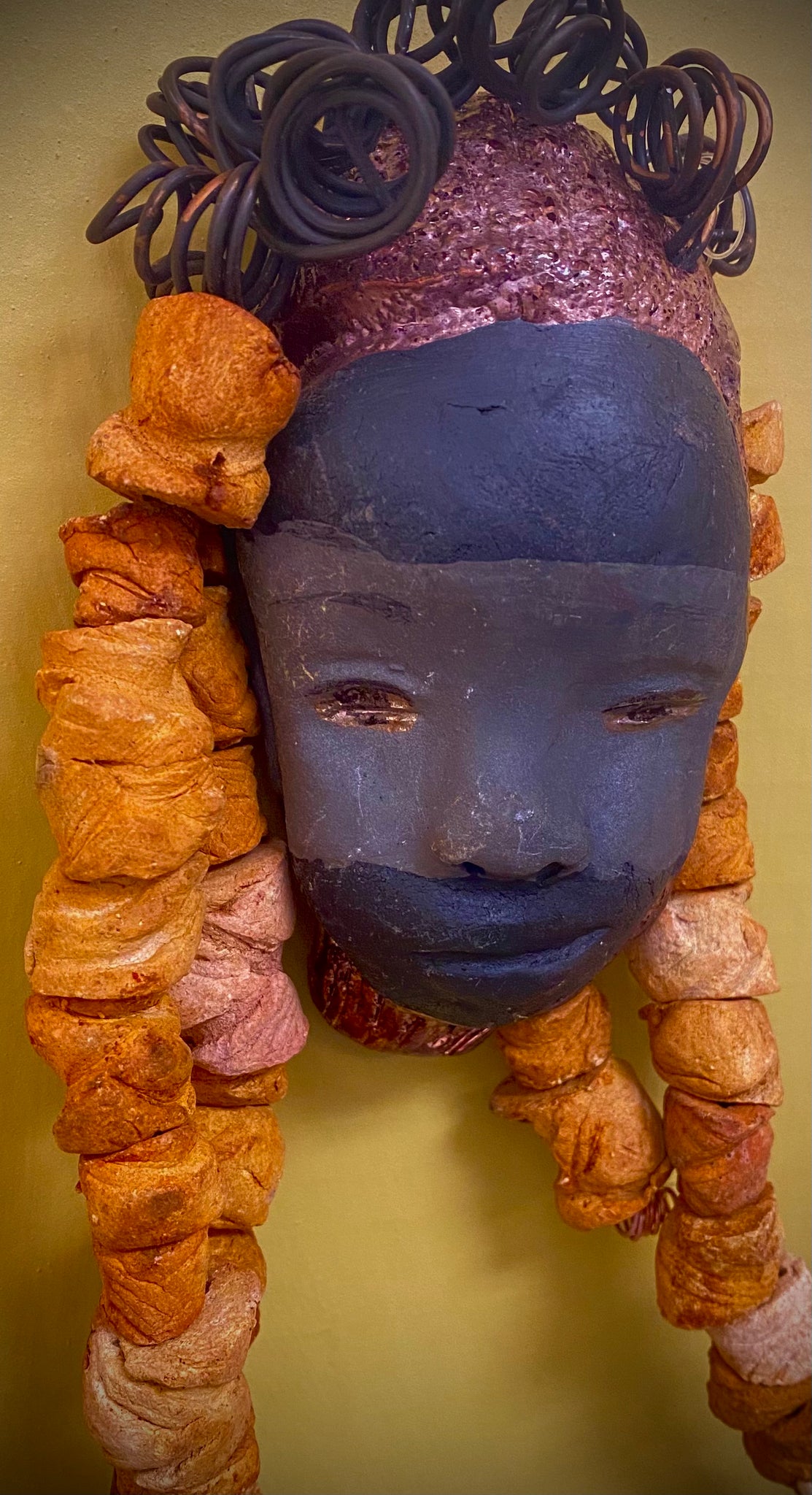 Meet Diya! I don't like to be bias but Diya turned out to look super special to me! I started making art soon after seeing authentic African artwork at the Smithsonian Museum of African Art. I was in total awe.  Diya was inspired by my visit there.  Diya  has over 30 feet of 16 gauge wire for hair and over 25  earthy raku beads. She has a two tone  smoked  and antique copper face and lips. She  is ready to be hung! I suggest finding Diya a small space with a cozy feel.
