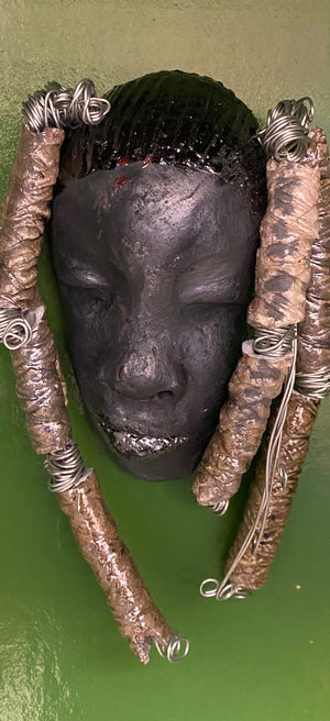 Meet Abbas! I started making art soon after seeing authentic African artwork at the Smithsonian Museum of African Art. I was in total awe.  Abbas was inspired by my visit there.   Abbas  4" x 7" and weighs 8.6 ozs. Abbas's face is a lovely smoky black. She has nine textured beads that are off white dread locks.
