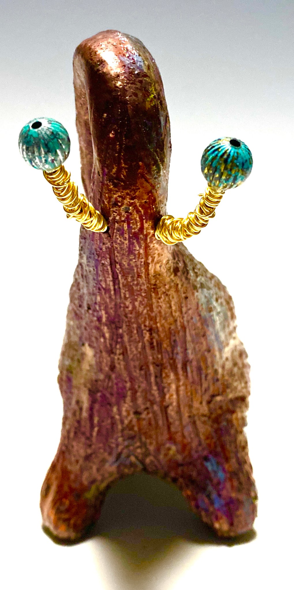 Have you HERD!!!!!!     Elephants are one of my favorite animals to create. They are so majestic"  Just one of these lovely Raku Fired Elephant will make an excellent gift for your  BFF,  or just for you .    This raku fired elephant stands 6" x 2" x 2.5" and weighs  12  ounces. She has beaded tusks and a textured copper metallic  body. Perfect for a gift or to add to your collection.