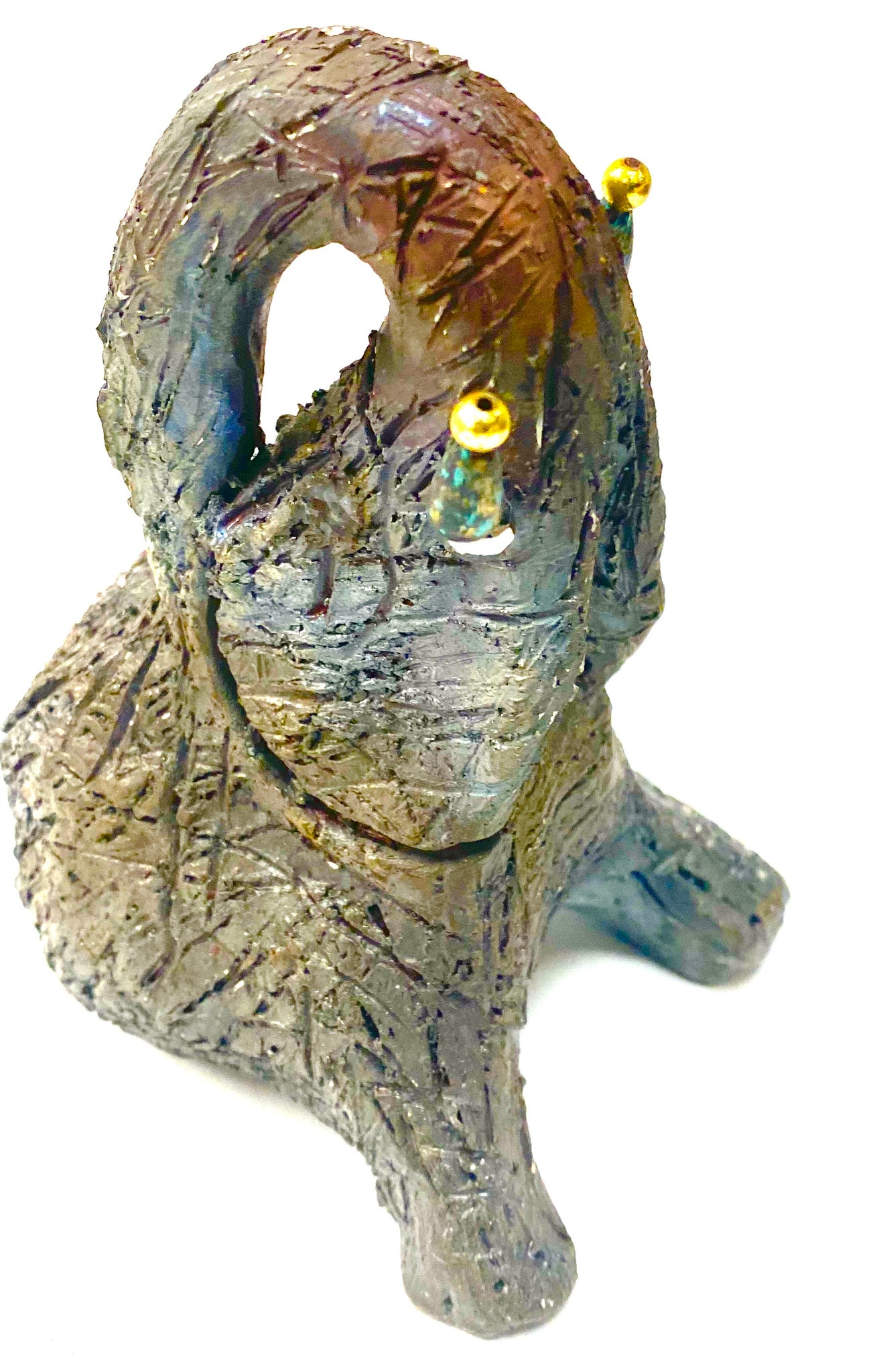 Have you HERD!!!!!!     Elephants are one of my favorite animals to create. They are so majestic"  Just one of these lovely Raku Fired Elephant will make an excellent gift for your  BFF,  or just for you .    This raku fired baby elephant sits 5.5" x 4" x 4" and weighs 10 ounces. She has beaded tusks and a textured copper body.  This little baby is Nice!
