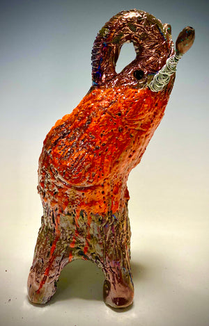 Raku Elephant Have you HERD!!!!!!  Just one of these lovely Raku Fired Elephant will make an excellent gift for your  friend, sorority or for your home’ special place centerpiece.   8.5" x 3" x 5" 14 ozs Beautiful two tone copper and orange rust raku elephant. Beaded tribal tusk. For decorative purposely only
